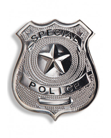 Badge policier en mÃ©tal dans une pochette sur papier cartonnÃ©