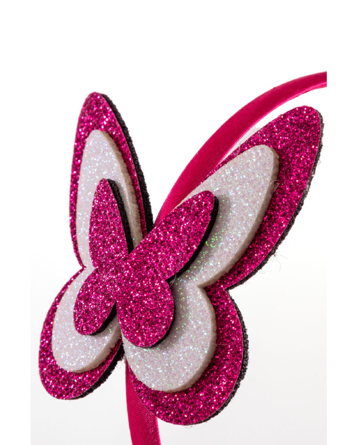 Serre tête papillon glitter fuchsia/blanc avec cavalier